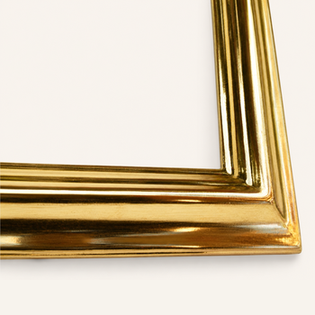 Mitred corner of the gold frame joined with a wooden spline, red bole visible beneath the burnished 23-karat gold